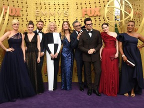 (FILES) In this file photo taken on September 22, 2019 "Schitt's Creek" cast members arrive for the 71st Emmy Awards at the Microsoft Theatre in Los Angeles. - Schitt's Creek won Outstanding Comedy Series along with 6 other during the 72nd Primetime Emmy Awards ceremony held virtually on September 20, 2020. Hollywood's first major Covid-era award show will look radically different to previous editions, with no red carpet and a host broadcasting from an empty theater in Los Angeles, which remains under strict lockdown.