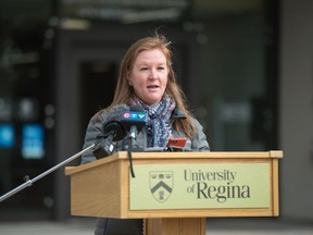 Emily Eaton, co-author of the Putting Equity into Action report, speaks to media outside Regina City Hall on Sept. 17, 2020.