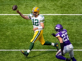 Aaron Rodgers, 12, of the Green Bay Packers threw four touchdown passes Sunday against the Minnesota Vikings, but that wasn't enough to help Rob Vanstone's fantasy football team post a Week 1 victory.