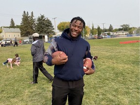 Saskatchewan Roughriders defensive end Charleston Hughes was all smiles during the Reggie City Freestyle Football Camp at the Access Communications Community Park on the weekend.