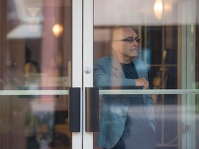 Ron Dorey, owner of Cornwall Optical, stands in the foyer in front of his shop on Scarth Street in Regina, Saskatchewan on Sept. 9, 2020.