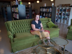 Annabel Townsend, owner of The Penny University Bookstore, sits in her new shop on Albert Street in Regina, Saskatchewan on Sept. 10, 2020.