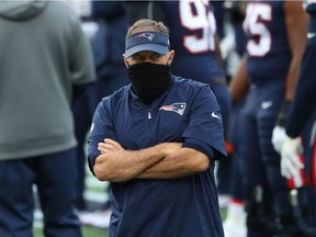 Head coach Bill Belichick of the New England Patriots looks on during warm ups prior to their game against the San Francisco 49ers at Gillette Stadium on October 25, 2020 in Foxborough, Massachusetts.