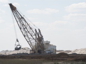 A dragline works near the Shand power plant, which mines coal, near Estevan, Sask. in May 2019.