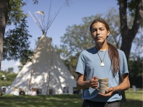 Tristen Durocher in front of the camp he set up across from the Legislative Building a year ago to draw attention to northern Indigenous suicides.