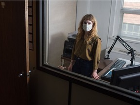 Amber Goodwyn, acting executive director for Regina's CJTR radio station, stands in a studio booth in the station's office on 8th Avenue in Regina on Sept. 17, 2020.