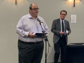 Murad Al-Katib (left), president and CEO of AGT Food and Ingredients Inc. and board member of Economic Development Regina (EDR), presents EDR's 2020-2030 growth plan for Regina along with Mayor Michael Fougere.