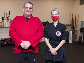 Corey Pickering, the owner and head instructor of Jishin Martial Arts, and Kaitlyn Pickering, a senior instructor, stand in the Jishin studio in Regina, Saskatchewan on Oct. 1, 2020.