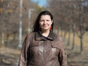 Elizabeth Cooper, an assistant professor in the Faculty of Kinesiology and Health Studies at the University of Regina, stands near the university in Regina, Saskatchewan on Oct. 8, 2020. Cooper has received funding for a research project called Nurturing Warriors: Understanding Mental Wellness and Health Risk Behaviours among Young Indigenous Men.