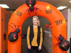Chelsea Galloway, manager of major events and entertainment for Evraz Place, stands with some Halloween-themed decorations in the Evraz Place administration office in Regina, Saskatchewan on Oct. 8, 2020. Evraz is planning a trick-or-treating event for Oct. 31.
