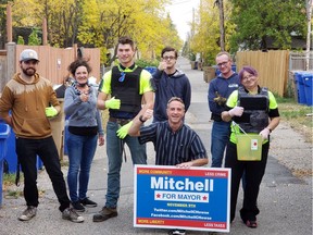 Mitchell Howse (kneeling) joined supporters recently in cleaning up a Regina neighbourhood. Howse is running for mayor in the 2020 Regina municipal election. Photo courtesy Mitchell Howse.
