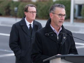 Kim Onrait, executive director of citizen services for the City of Regina, right, speaks at a news conference regarding city construction projects held on Victoria Avenue in Regina, Saskatchewan on Oct. 15, 2020.