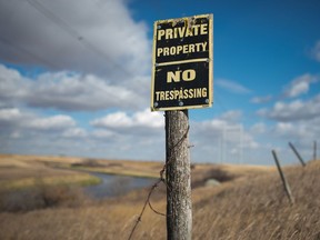 A no trespassing sign sits on the edge of a rural property near Regina.