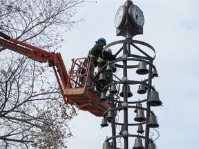 Electrical work is carried out on the Glockenspiel in Victoria Park in Regina, Saskatchewan on Oct. 21, 2020. The instrument was slated to have its bells tested this week.