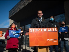 Saskatchewan NDP leader Ryan Meili, at podium, speaks to media during a news conference held on Avonhurst Drive in the Regina Coronation Park constituency.