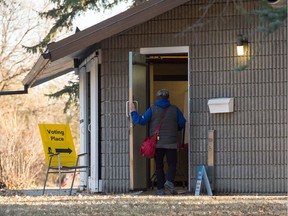 A person enters a polling station on Elphinstone Street in Regina, Saskatchewan as voting is underway for the Saskatchewan provincial election on Monday Oct. 25, 2020.