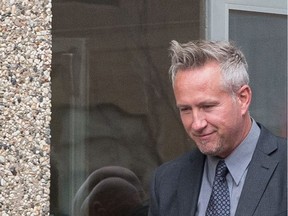 Regina Police Service Const. Roger Wiebe, left, leaves Regina Provincial Court, where he is on trial for a charge of assault, in Regina, Saskatchewan on Oct. 27, 2020.