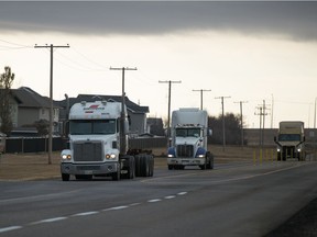 trio of semi trucks drive along 9th Avenue North in Regina on Oct. 29, 2020.