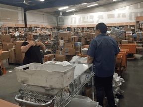 The main Iqaluit post office already overwhelmed by parcels before the pandemic. Now, the warehouse is flooded with thousands of packages – mostly from Amazon.