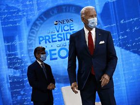 Democratic Presidential candidate Joe Biden and moderator George Stephanopoulos arrive for an ABC News town hall in Philadelphia on October 15, 2020.