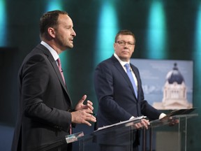 Saskatchewan Party Leader Scott Moe, right, and NDP Leader Ryan Meili, left, speak during the Leaders' Debate at the Provincial Archives in Regina on Wednesday Oct. 14, 2020.