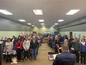 A photo originally posted to Facebook has been digitally altered to blur the faces of attendees. The photo shows a religious gathering held at the Full Gospel Outreach Centre in Prince Albert.