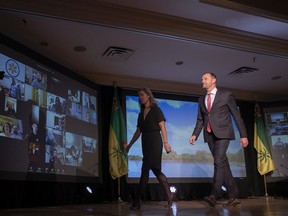 Leader Ryan Meili, right, and his wife Mahli Brindamour walk off stage at the Saskatchewan NDP election night headquarters at the Delta Marriott hotel in downtown Saskatoon on Monday, October 26, 2020.