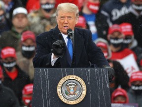 U.S. President Donald Trump addresses thousands of supporters during a campaign rally at Capital Region International Airport October 27, 2020 in Lansing, Michigan.