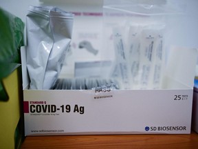 A box with Rapid Antigen Tests (RAT), in a pharmacy in Paris.