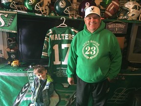 Don Beck is shown in his Saskatchewan Roughriders shrine — Clubhouse 23 — with his grandson, Oakley Mallette, in 2019.
