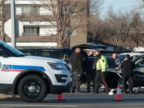 Regina police, a coroner, and Omega Transfer Services personnel work on scene after a fatal collision on Albert Street South that claimed the life of a 21-year-old pedestrian on Nov. 4, 2020.