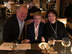 Former Saskatchewan Roughriders quarterback Mike Nott, left, with his wife, Lesley (right), and grandson (Taylor O'Brien).