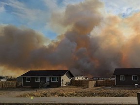 Grass fire smoke envelopes the south side of Pasqua First Nation, threatening homes in the community on the afternoon of Nov. 5, 2020. Cathie Johns-Wick/Facebook.