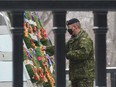 Pvt. John Cayari places his poppy on the cenotaph at a Remembrance Day ceremony held at Victoria Park in Regina, Saskatchewan on Nov 11, 2020. BRANDON HARDER/ Regina Leader-Post