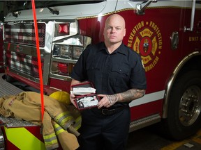 Firefighter Tyler Packham, president of Regina Professional Fire Fighters Association L181, stands holding a Narcan kit at Fire Hall #6 in Regina, Saskatchewan on Nov 11, 2020.