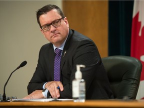 Newly-minted Saskatchewan Health Minister Paul Merriman listens during a news conference regarding COVID-19 at the Saskatchewan Legislative Building in Regina, Saskatchewan on Nov 13, 2020.