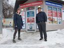 Danielle Froh, left, stands in front of the Regina Family Pharmacy with pharmacist Brijesh Patel in Regina, Saskatchewan on Nov. 17, 2020. Froh is organizing a community fridge, which will be located outside the pharmacy, in order to help with food security issues in the city. She says Patel has been a big help to her with the project.