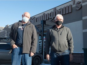 Chris Oleson, left, and Rob Bogdan stand outside Birmingham's Vodka & Ale House, where 100 Men Who Care Regina held its meetings until COVID-19 forced the group to meet via Zoom.