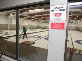 A masks required sign is seen at the Callie Curling Club in Regina.