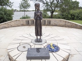 The statue, "Bitter Memories of Childhood" on the legislative grounds commemorating Ukrainians killed in the Holodomor shows why we need a similar residential school memorial. (Photo: Postmedia)