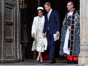 In this file photo taken on March 11, 2019 Britain's Prince Harry, Duke of Sussex (C) and Meghan, Duchess of Sussex (L) leave after attending a Commonwealth Day Service at Westminster Abbey in central London, on March 11, 2019.
