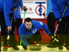 Kevin Fetsch watches his rock at the Regina Men's Bonspiel at the Tartan Curling Club in 2012.