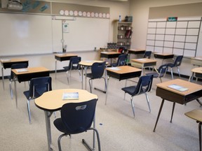 Desks are placed with space between them at St. Gregory School in Regina, Saskatchewan on Sept. 1, 2020. Students will soon be returning to classrooms. Staff and students will need to follow new safety guidelines as school resumes during the COVID-19 pandemic.