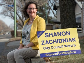 New city councillor for Ward 8 Shanon Zachidniak sits by one of her campaign signs on 2nd Avenue North in Regina on Nov. 5, 2020.