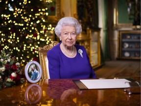 In this pool image released on December 25th, Queen Elizabeth II records her annual Christmas broadcast in Windsor Castle, Windsor, England.