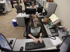 Candace Volman (front) and Heidi Forsythe take 9-1-1 calls in the RCMP "F" Division Headquarter's Division Operational Communication Centre in Regina, Sask. on Wednesday, March 5, 2014.