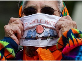 Maria Linklater wears an orange shirt and mask that reads "every child matters" to raise awareness of the devastating impact of the residential school system on Indigenous people. Photo taken in Saskatoon, SK on Tuesday, September 29, 2020.