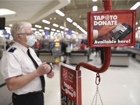 Gord Wilson staffs a Salvation Army kettle at the Rochdale Blvd. Superstore. Wilson has 50 years experience with the church's charitable activities.
