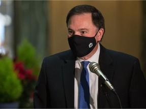 Saskatchewan Justice Minister Gord Wyant is seen during a media scrum in the Rotunda at the Saskatchewan Legislative Building in Regina, Saskatchewan on Dec. 9, 2020.