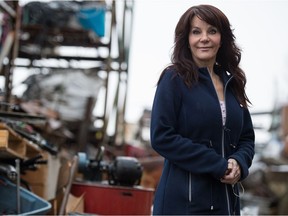 Karen Kissner, whose father owns CMS Metal Products, stands in her family's scrap metal yard on 8th Avenue in Regina, Saskatchewan on Dec. 9, 2020. The provincial government has introduced new legislation to regulate the sale of scrap metal.